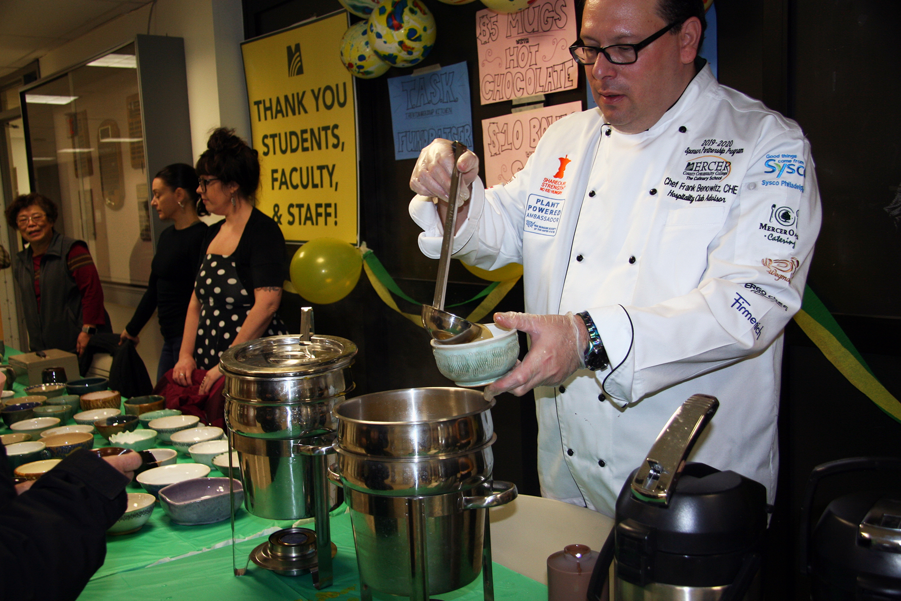 Frank Benowitz serves soup