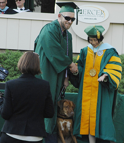 Gabe Matt, service dog Louie,  Dr. Jianping Wang